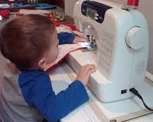 boy playing Sewing machine 